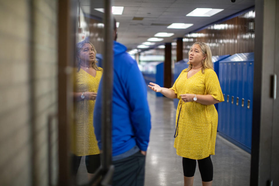 North High School Principal Mauri Friestleben, who has been vocal in her support for school-based police, talks to a coworker on campus in 2019. (Photo courtesy Mark Brown / University of St. Thomas)