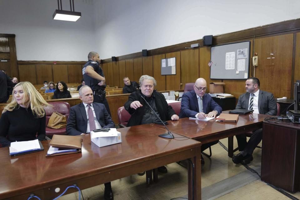 Steve Bannon, center, appears in Manhattan Supreme Court with his lawyers Susan Carman left, John Carman, second from left, Harlan Protass, second from right, and Joshua Kirshner, Tuesday, Feb. 28, 2023 in New York. Bannon is accused of fraud in connection with a charity raising money for a wall on the southern U.S. border. (AP Photo/Curtis Means/DailyMail via AP, Pool)