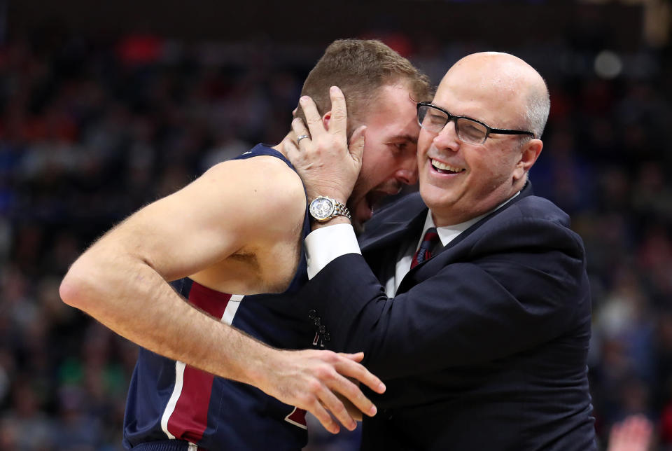 SALT LAKE CITY, UTAH - MARCH 21: Head coach Greg Herenda of the Fairleigh Dickinson Knights embraces Nadi Beciri #24 of the Fairleigh Dickinson Knights after a basket against the Gonzaga Bulldogs during the second half in the first round of the 2019 NCAA Men's Basketball Tournament at Vivint Smart Home Arena on March 21, 2019 in Salt Lake City, Utah. The Gonzaga Bulldogs won 87-49. (Photo by Tom Pennington/Getty Images)