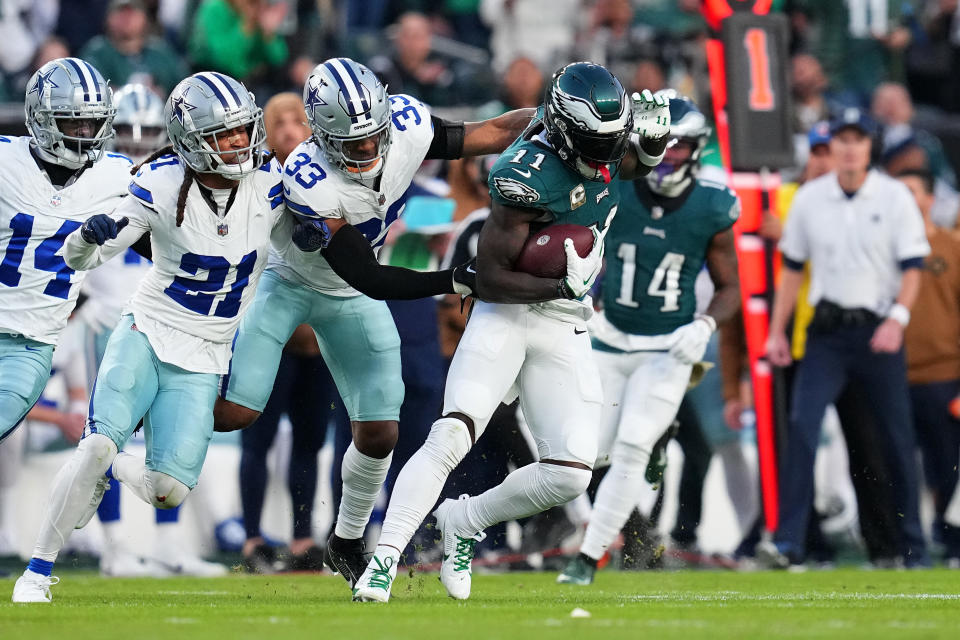 PHILADELPHIA, PENNSYLVANIA – NOVEMBER 05: A.J. Brown #11 of the Philadelphia Eagles runs the ball after a catch <a class="link " href="https://sports.yahoo.com/nfl/players/34132/" data-i13n="sec:content-canvas;subsec:anchor_text;elm:context_link" data-ylk="slk:Damone Clark;sec:content-canvas;subsec:anchor_text;elm:context_link;itc:0">Damone Clark</a> #33 of the Dallas Cowboys during the first half at Lincoln Financial Field on November 05, 2023 in Philadelphia, Pennsylvania. (Photo by Mitchell Leff/Getty Images)