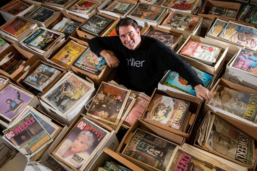 Irvine, CA - January 06: Brian Calle, CEO and Publisher of L.A. Weekly, is now the owner of O.C. Weekly and is photographed in the Irvine Weekly office, with a collection of boxes holding what reamins of old O.C. Weekly issues, in Irvine, CA, Friday, Jan. 6, 2023. Even with all the negative financial aspects of owning a "print" publication, Calle says he still sees it as financially viable and wants to take on the challenge. (Jay L. Clendenin / Los Angeles Times)