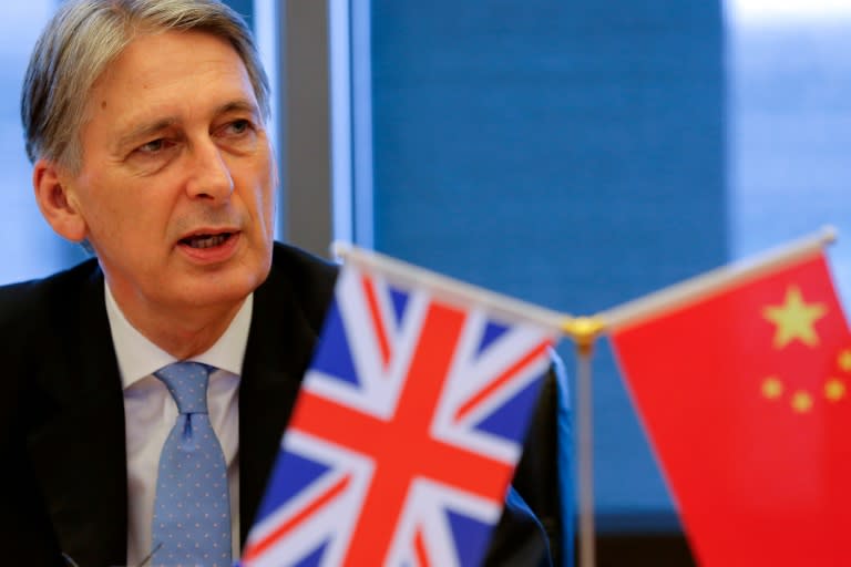 Britain's new finance minister Philip Hammond attends roundtable talks at the Bank of China in Beijing on July 22, 2016