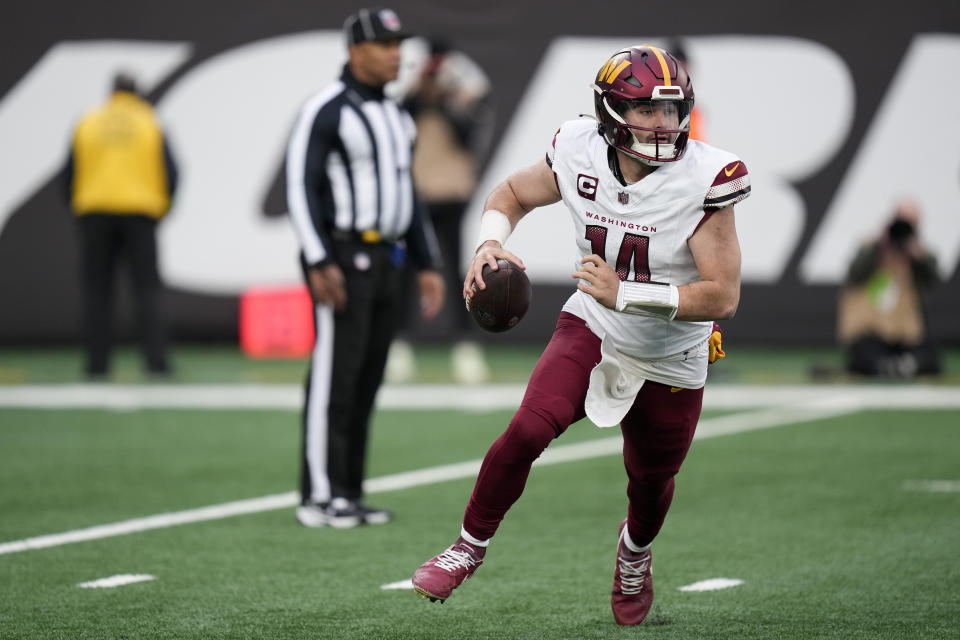 Washington Commanders quarterback Sam Howell (14) looks to pass against the New York Jets during the second half of an NFL football game, Sunday, Dec. 24, 2023, in East Rutherford, N.J. (AP Photo/Seth Wenig)