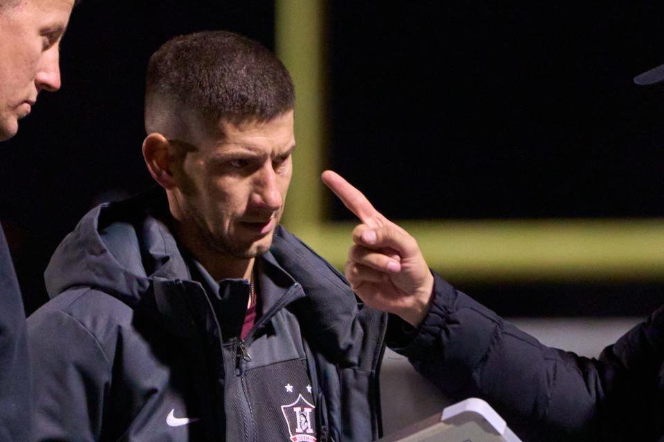 Hamilton Huskies head coach Tim Vance meets with his coaching staff between the first and second half against the Brophy Broncos at Brophy Preps Sports Campus in Phoenix, on Thursday, Feb. 2, 2023.