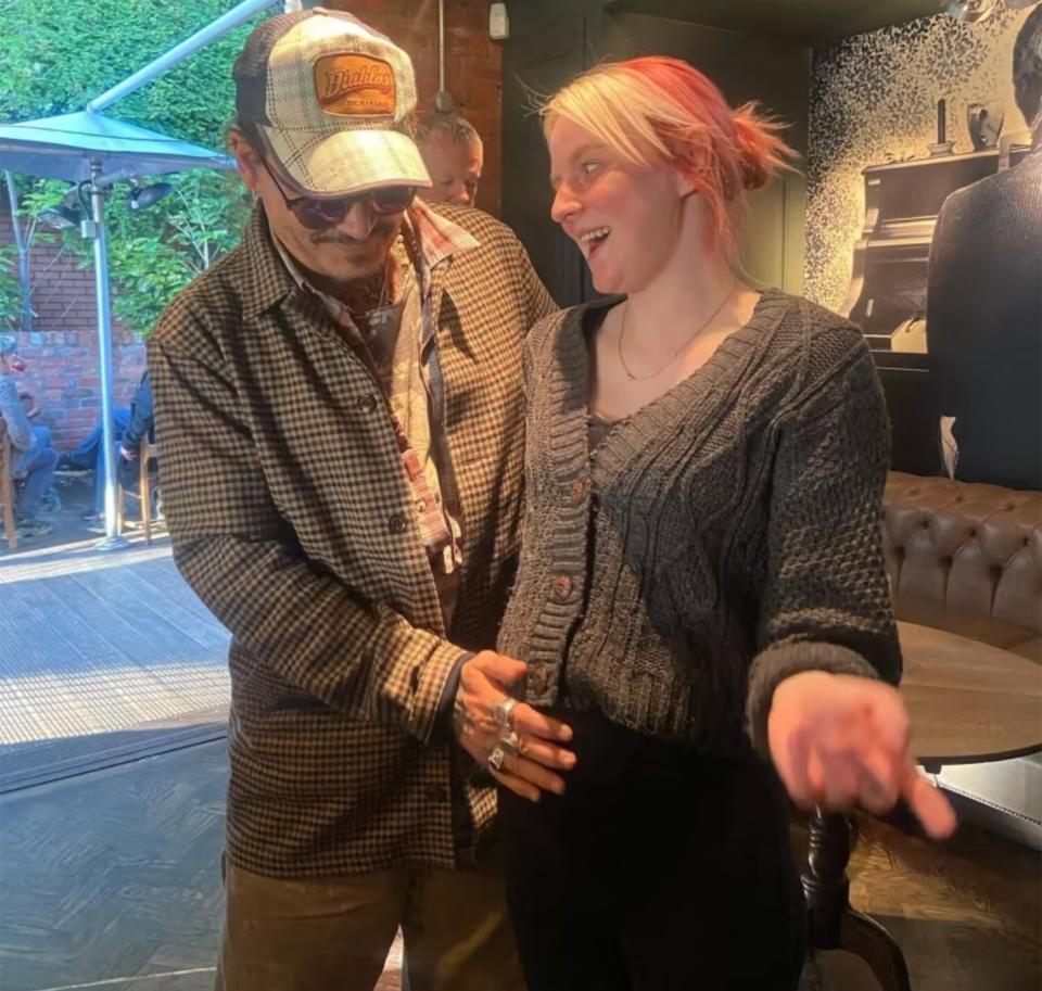 Johnny Depp gives parenting advice to pregnant bar manager Laura, at the Bridge Tavern in Newcastle.