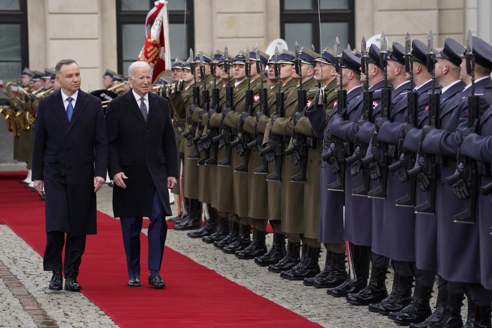 Polish President Andrzej Duda, left, welcomes President Joe Biden at the Presidential Palace in Warsaw on Feb. 21, 2023.