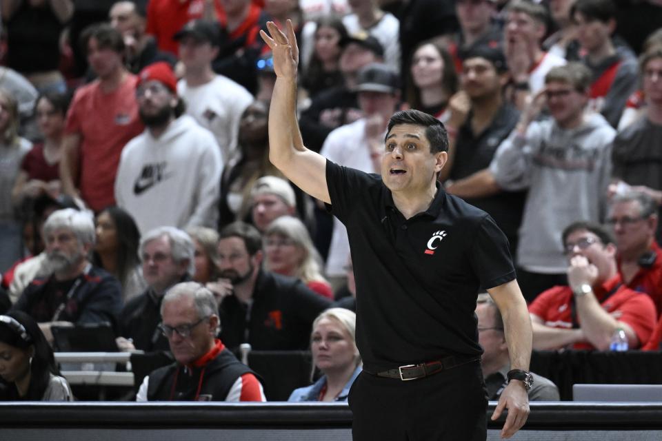 Cincinnati head coach Wes Miller signals to players against Texas Tech during the second half of an NCAA college basketball game, Saturday, Feb. 3, 2024, in Lubbock, Texas. (AP Photo/Justin Rex)