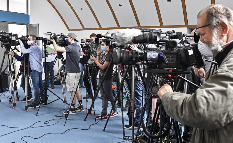 Journalists attend a press conference by First Prosecutor Hans Christian Wolters on the Madeleine McCann case at the public prosecutor's office in Braunschweig, Germany, Thursday, June 4, 2020. A German man has been identified as a suspect in the case of a 3-year-old British girl who disappeared 13 years ago while on a family holiday in Portugal. (AP Photo/Martin Meissner)