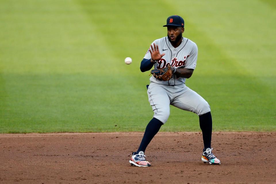 Tigers shortstop Niko Goodrum fields a ground ball off the bat of Reds designated hitter Matt Davidson in the third inning against the Cincinnati Reds at Great American Ball Park in Cincinnati on Friday, July 24, 2020.