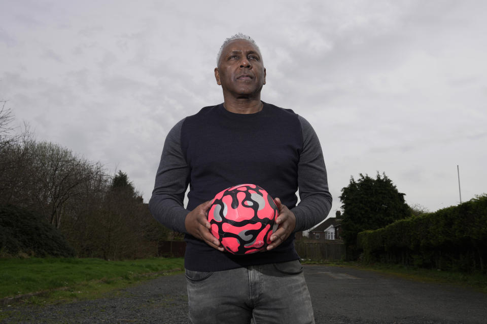 Former England international soccer player Ricky Hill poses for a photograph in Luton, England, Wednesday, March 20, 2024. Racism has long permeated the world’s most popular sport, with soccer players subjected to racist chants and taunts online. While governing bodies like FIFA and UEFA have taken steps to combat the abuse of players, the lack of diversity in the upper ranks at major clubs remains an unsolved problem. Hill has just left the U.K. to take a management position with a suburban Chicago soccer club. (AP Photo/Kin Cheung)