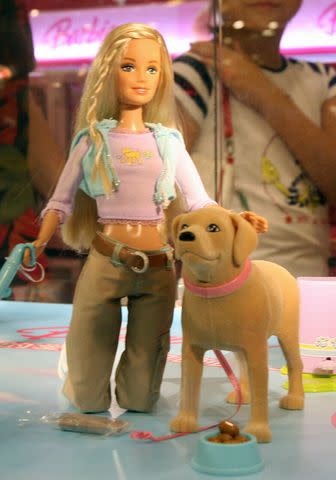 <p>MARK RALSTON/AFP via Getty</p> Barbie and Tanner