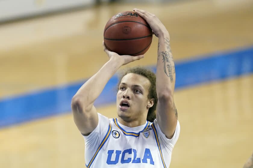 FILE - UCLA forward Mac Etienne (12) shoots the ball during the second half of an NCAA basketball game.