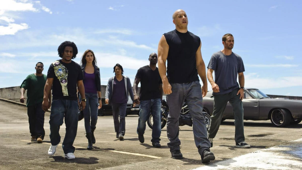 'Fast and Furious 5' (2011) L-R Don Omar, Tego Calderon, Gal Gadot, Sung Kang, Tyrese Gibson, Vin Diesel, Paul Walker (Credit: Universal Pictures)