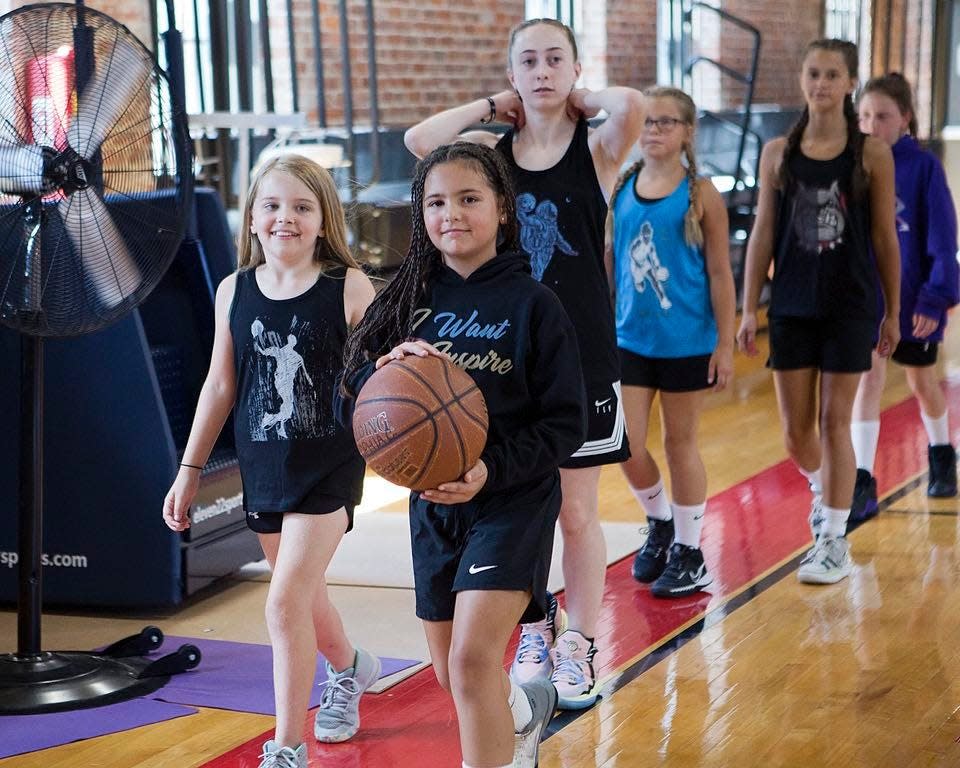 Youth basketball players wear items from the clothing line, Lexicon, Athletic Wear That Inspires.