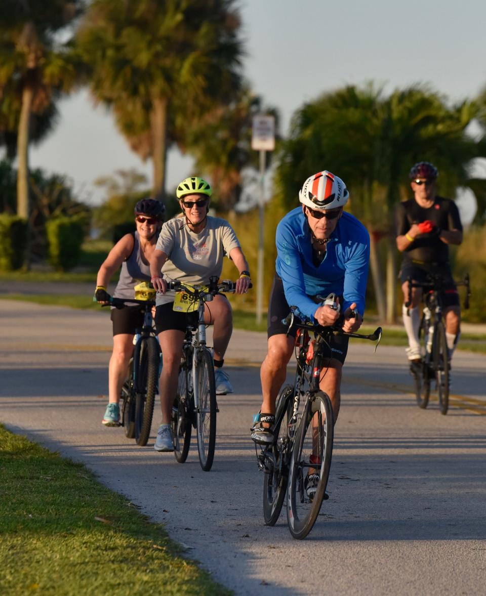 Competitors race in the bicycling portion of the 2022 Cocoa Beach Triathlon and Duathlon. The 2023 event was recommended for an $11,500 county sports event grant.