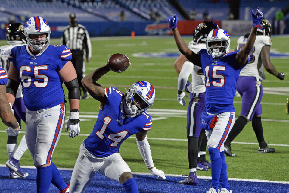 Buffalo Bills wide receiver Stefon Diggs (14) celebrates after scoring a touchdown during the second half of an NFL divisional round football game against the Baltimore Ravens Saturday, Jan. 16, 2021, in Orchard Park, N.Y. (AP Photo/Adrian Kraus)