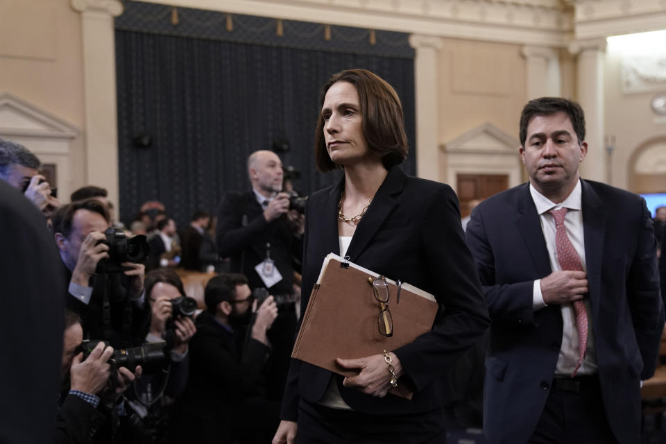 Former White House national security aide Fiona Hill, joined by her attorney Lee Wolosky, right, departs after testifying before the House Intelligence Committee on Capitol Hill in Washington, Thursday, Nov. 21, 2019, during a public impeachment hearing of President Donald Trump's efforts to tie U.S. aid for Ukraine to investigations of his political opponents. (AP Photo/J. Scott Applewhite)