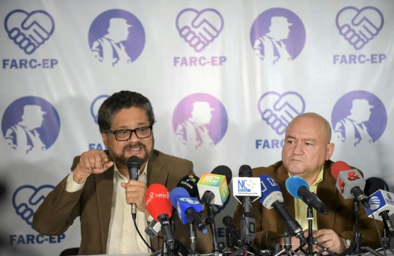 FARC commanders Ivan Marquez (L) and Carlos Lozada deliver a press conference announcing the launching of their political party in Bogota on July 24, 2017.The FARC guerrillas announced Monday they will launch a legal political party on September 1