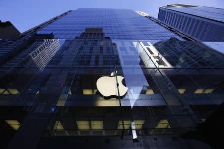 The Apple logo is lit in Sydney September 19, 2014. REUTERS/David Gray