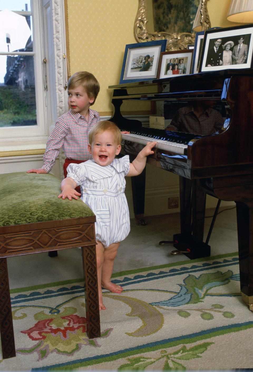 Prince Harry and Prince William playing piano