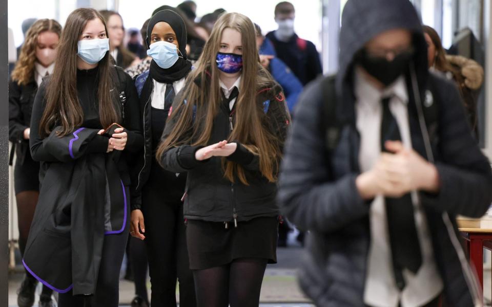 Pupils at Rosshall Academy wear face coverings as it becomes mandatory in corridors and communal areas - Getty Images Europe