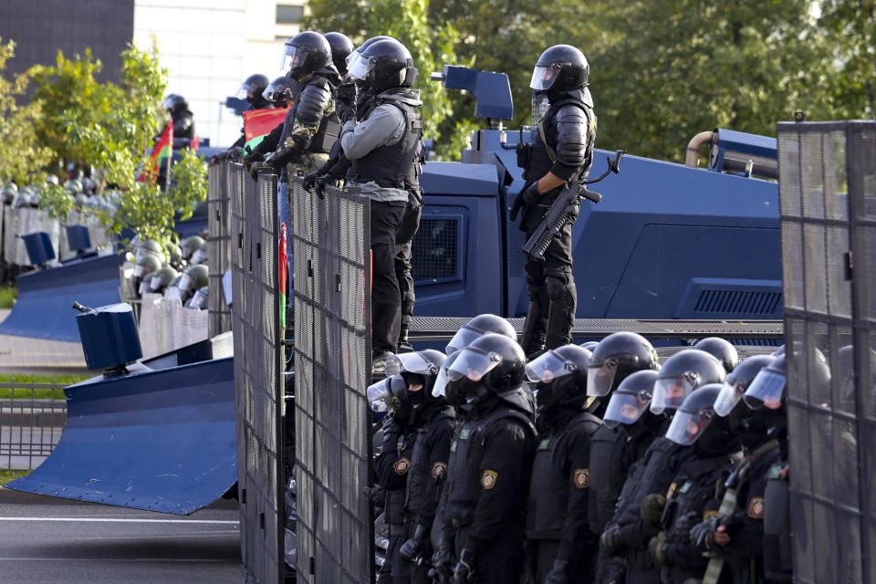 Riot police prepare to stop a Belarusian opposition supporters' rally protesting the official presidential election results in Minsk, Belarus, Sunday, Sept. 13, 2020. Protests calling for the Belarusian president's resignation have broken out daily since the Aug. 9 presidential election that officials say handed him a sixth term in office. (TUT.by via AP)