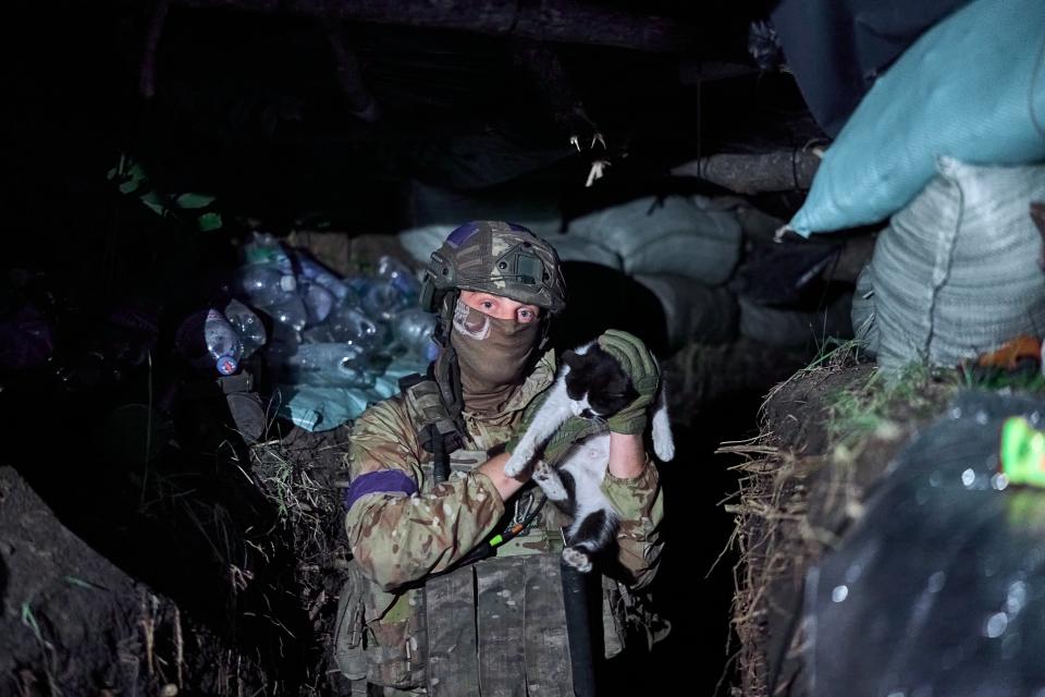 Infantry gather after securing the position for the 3rd Assault Brigade at sunset in Kharkiv Region (Getty Images)