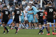 Argentina players celebrate after the Tri-Nations rugby test between Argentina and New Zealand at Bankwest Stadium, Sydney, Australia, Saturday, Nov.14, 2020. Argentina defeated the All Blacks 25-15. (AP Photo/Rick Rycroft)