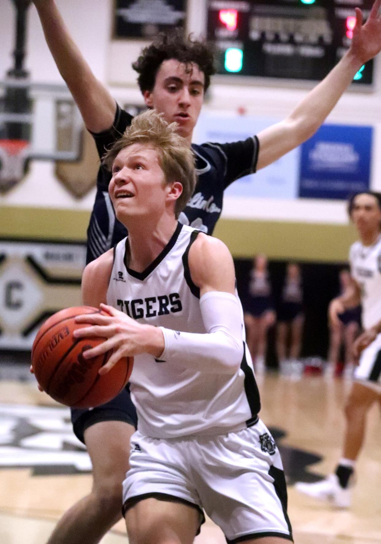 Central's Mason Brown (3) goes up for a shot as Franklin County's Brayden Powers (20) guards him during the boys’ basketball game at Central Magnet ,on Friday, Jan. 26, 2024.