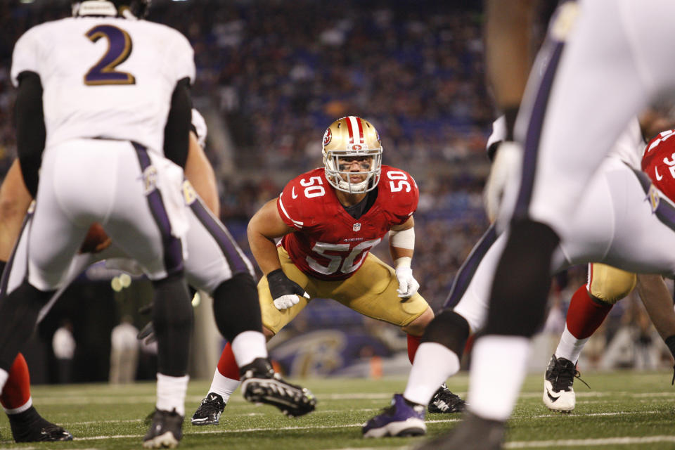 BALTIMORE, CA - AUGUST 7: Chris Borland #50 of the San Francisco 49ers defends during the game against the Baltimore Ravens at M&T Bank Stadium on August 7, 2014 in Baltimore, Maryland. The Ravens defeated the 49ers 23-3. (Photo by Michael Zagaris/San Francisco 49ers/Getty Images)  