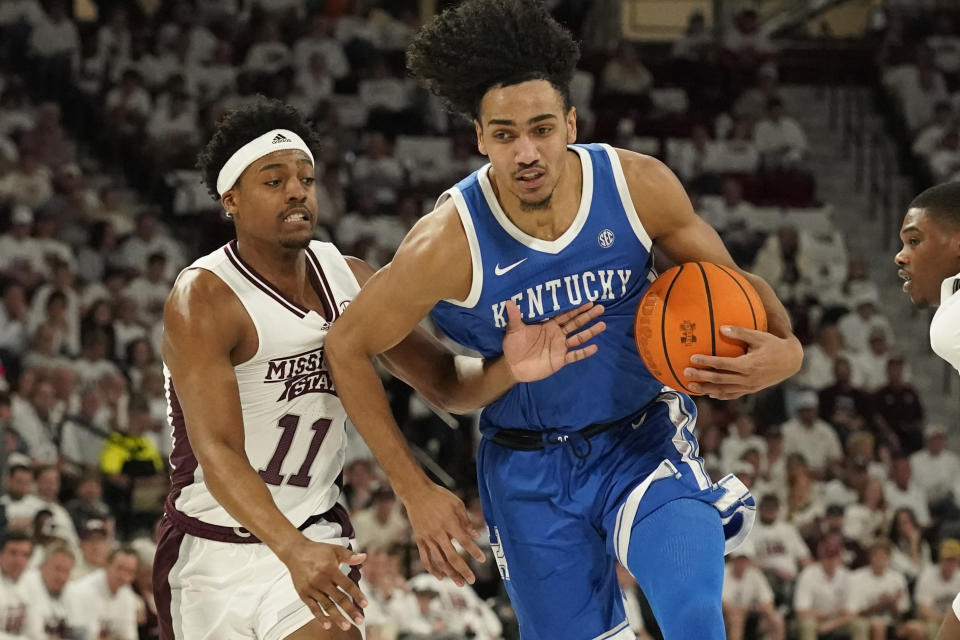 Mississippi State guard Eric Reed Jr. (11) attempts to steal the ball from Kentucky forward Jacob Toppin (0) during the first half of an NCAA college basketball game in Starkville, Miss., Wednesday, Feb. 15, 2023. (AP Photo/Rogelio V. Solis)