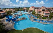 <p>Love to golf? Tucked away on low-maintenance Eagle Beach is a <a rel="nofollow noopener" href="http://www.diviresorts.com/divi-village-golf-beach-resort-aruba.htm" target="_blank" data-ylk="slk:golf and beach resort;elm:context_link;itc:0;sec:content-canvas" class="link ">golf and beach resort</a> with a few great all-inclusive packages—including one in which kids get to stay and eat for free. Golf is included after 3 p.m. and includes fees and carts, while kids will flip at the sight of the property's waterslide. (Adults, don’t worry: There’s a swim-up bar just for you.) Guests love being able to roam from one Divi property to another (like <a rel="nofollow noopener" href="http://www.travelandleisure.com/slideshows/best-affordable-all-inclusive-resorts/8" target="_blank" data-ylk="slk:Tamarijn Aruba All Inclusive;elm:context_link;itc:0;sec:content-canvas" class="link ">Tamarijn Aruba All Inclusive</a>), snacking at any of the group's 14 restaurants or 11 bars.</p>