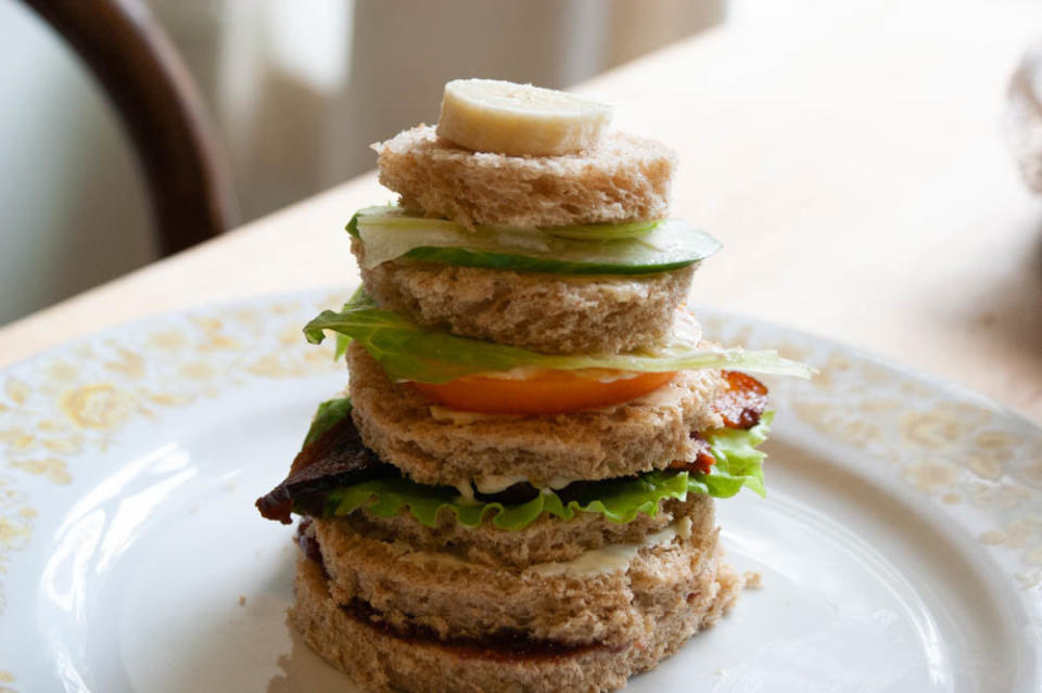 Russian Club Sandwich as described in a recipe in Bee Wilson&rsquo;s <i>Sandwiches: A Global History</i>. Club sandwiches are classically attributed to Americans but this Russian club features rounds of bread in descending height with jam, cream cheese and butter, in addition to classic club ingredients like bacon, lettuce and tomato. (Photo: Alana Dao)