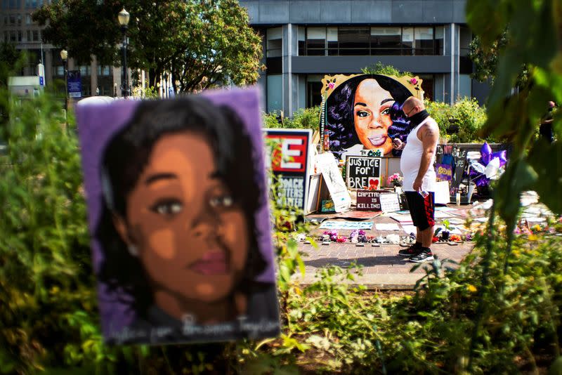 FILE PHOTO: People react after a decision in the criminal case against police officers involved in the death of Breonna Taylor, in Louisville