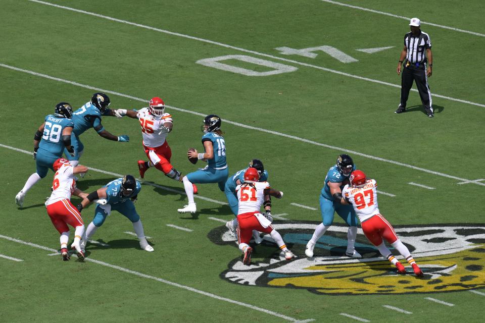 Jaguars' quarterback Trevor Lawrence (16) gets pressure from Kansas City Chiefs' defensive tackle Chris Jones, which allowed teammates George Karlaftis and Mike Danna to sack Lawrence as he was forced to step up in the pocket on the game's first series. The Chiefs had four sacks and seven quarterback hits in a 17-9 victory.