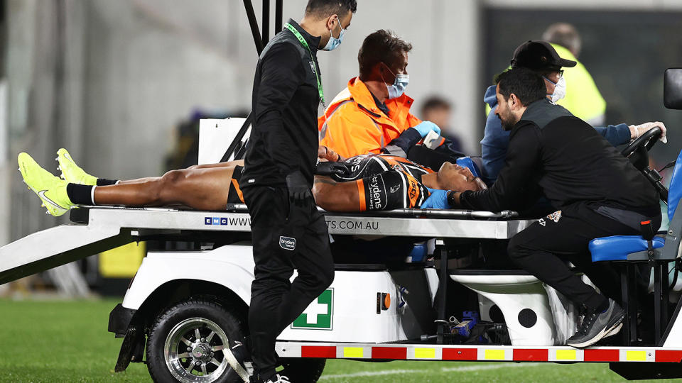 Michael Chee-Kam, pictured here being stretchered off the field.