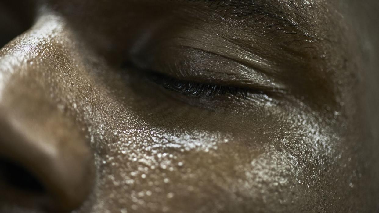 close up of mans sweaty face