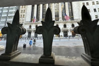 The New York Stock Exchange is seen, through a window guard, on Tuesday, April 16, 2024 in New York. Wall Street drifted toward gains as more corporate earnings come in, giving investors a break from fretting about if and when the Federal Reserve might cut interest rates. (AP Photo/Peter Morgan)