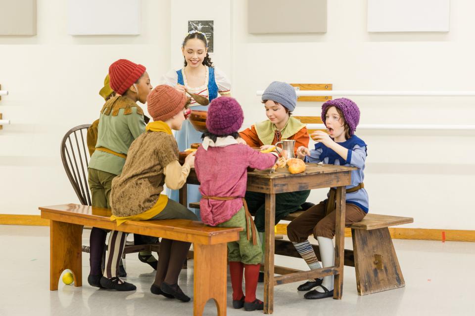 The Dwarfs enjoy a meal with Snow White in the Ballet Excel Ohio production of "Snow White," to be performed March 9 and 10 at the Akron Civic Theatre.