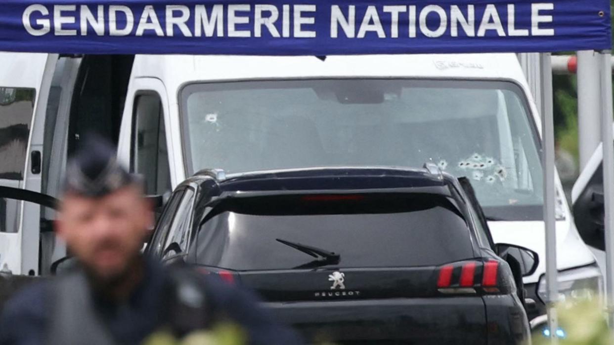  A bullet-ridden prison van is pictured at the site of a ramming attack which took place late morning at a road toll in Incarville in the Eure region of northern France. 