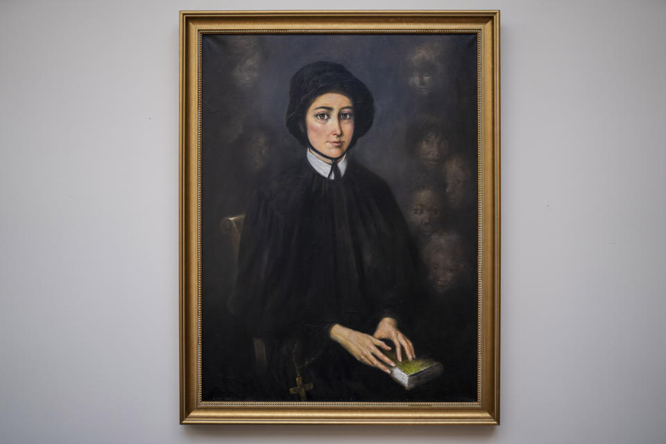 A portrait of Saint Elizabeth Ann Seton, the founder of the first American congregation of the Sisters of Charity, hangs in the meeting room of La Gras Hall where the leadership council of the order convenes, at the College of Mount Saint Vincent, a private Catholic college in the Bronx borough of New York, on Tuesday, May 2, 2023. In more than 200 years of service, the Sisters of Charity of New York have cared for orphans, taught children, nursed the Civil War wounded and joined Civil Rights demonstrations. Last week, the Catholic nuns decided that it will no longer accept new members in the United States and will accept the "path of completion." (AP Photo/John Minchillo)