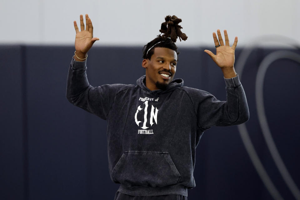 Former NFL and Auburn quarterback, Cam Newton, warms up during Auburn Pro Day, Tuesday, March 21, 2023, in Auburn, Ala. (AP Photo/Butch Dill)