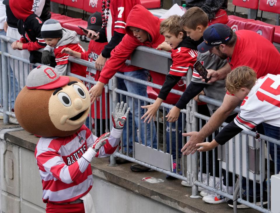 Oct. 7, 2023; Columbus, Oh., USA; 
Brutus Buckeye greets fans following a 37-17 win over the Maryland Terrapins in Saturday's NCAA Division I football game at Ohio Stadium.