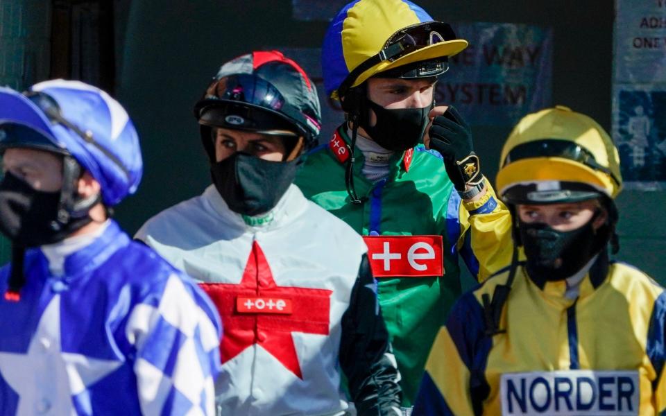 Jockeys prepare to face at Leicester Racecourse - PA