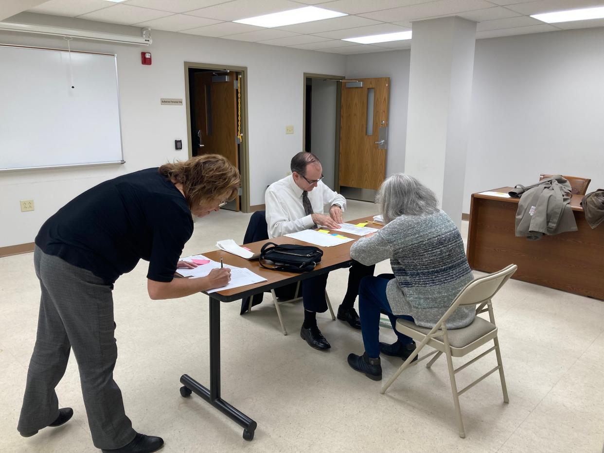 Ashland County Board of Elections officials recount the Sullivan township full-term election results Tuesday.