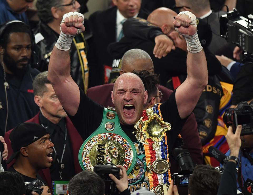 British boxer Tyson Fury celebrates after defeating US boxer Deontay Wilder in the seventh round during their World Boxing Council (WBC) Heavyweight Championship Title boxing match at the MGM Grand Garden Arena in Las Vegas on February 22, 2020. (Photo by Mark RALSTON / AFP) (Photo by MARK RALSTON/AFP via Getty Images)