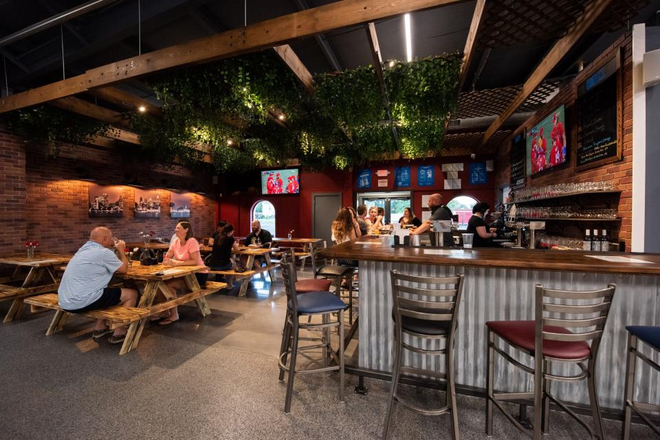 Customers gather around the taproom, on Thursday, July 6, 2023, at Broad Street Brewing, which opened its doors over Fourth of July weekend in Bristol Township.