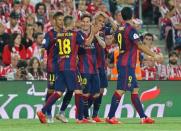 Lionel Messi celebrates with team mates after scoring the third goal for Barcelona Reuters / Gustau Nacarino