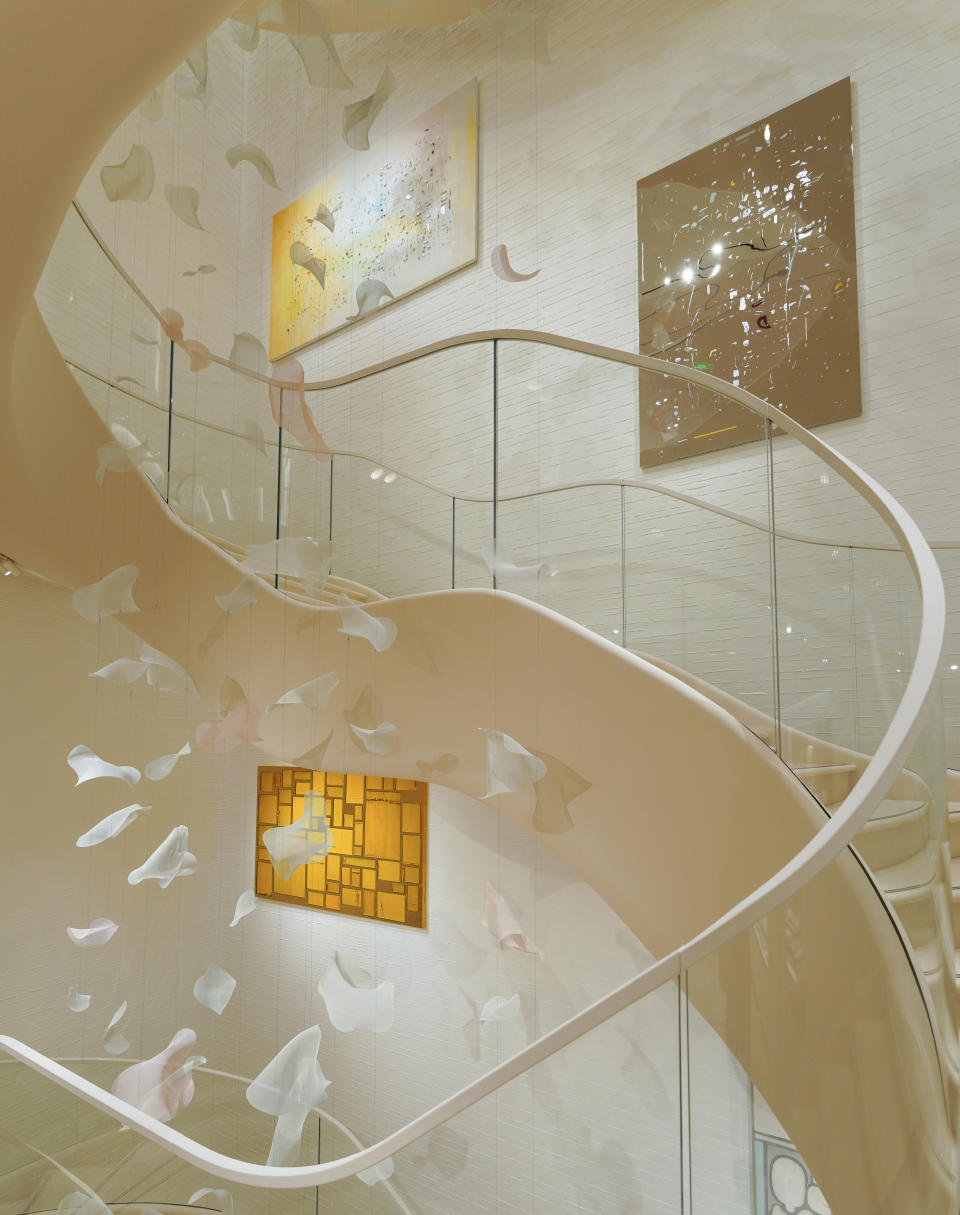 Dior’s Plaza 66 flagship features artworks by Hong Hao and a suspended petal installation by Studio Sawada Design.