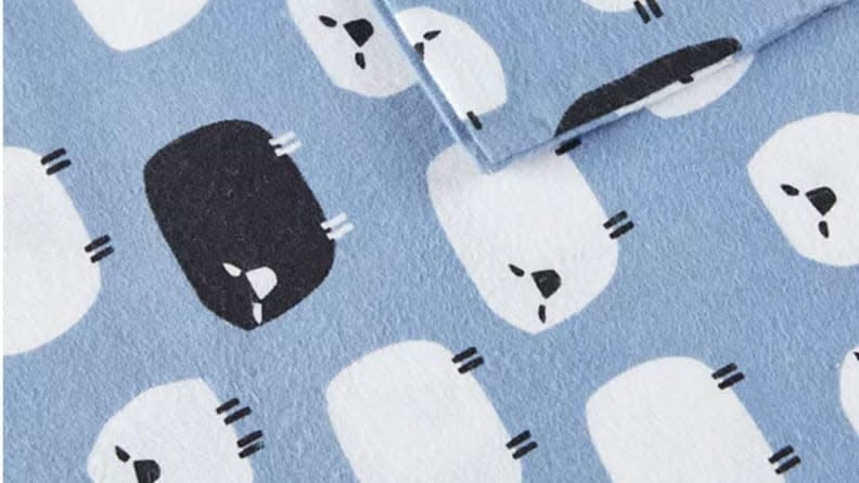 Woolrich even has a flannel sheet patterned with black and white sheep.